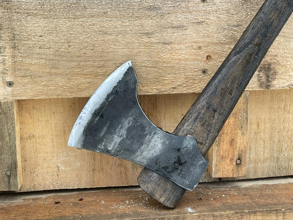 Hand forged Nordic axe head close up - traditional Scandinavian forest axe craftsmanship