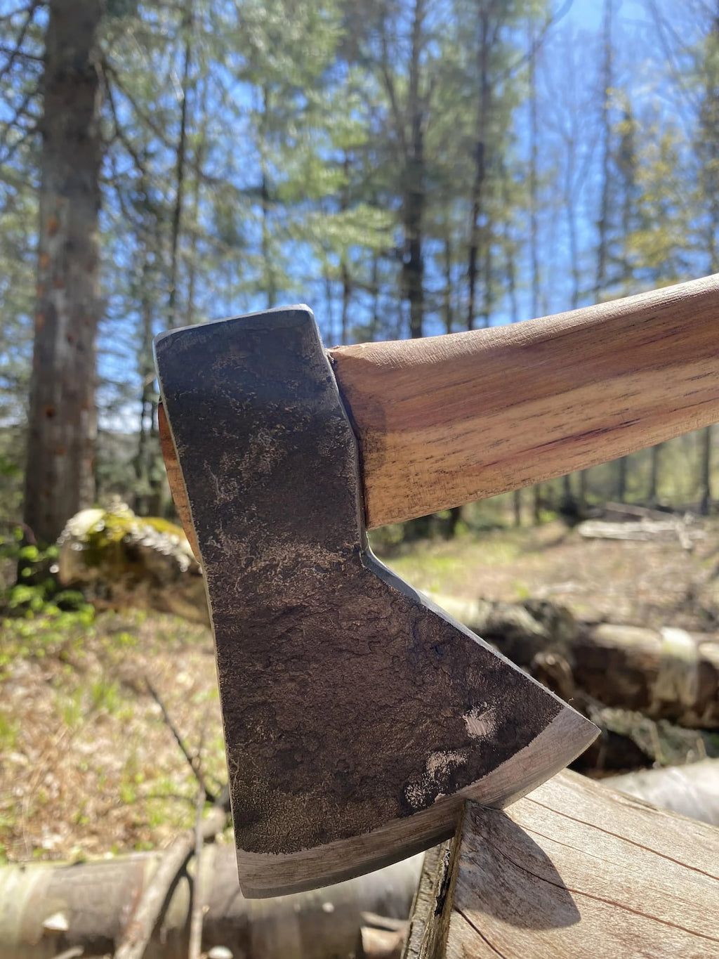 Compact Rockaway bushcraft hatchet featuring hand-forged steel construction and natural hickory wood handle

